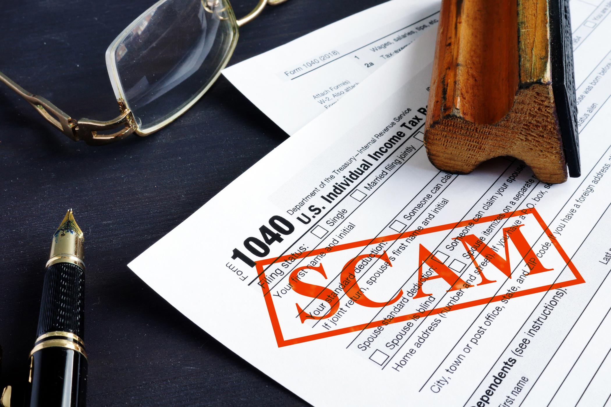 tax-scam-1040-GettyImages-1136139509-2100